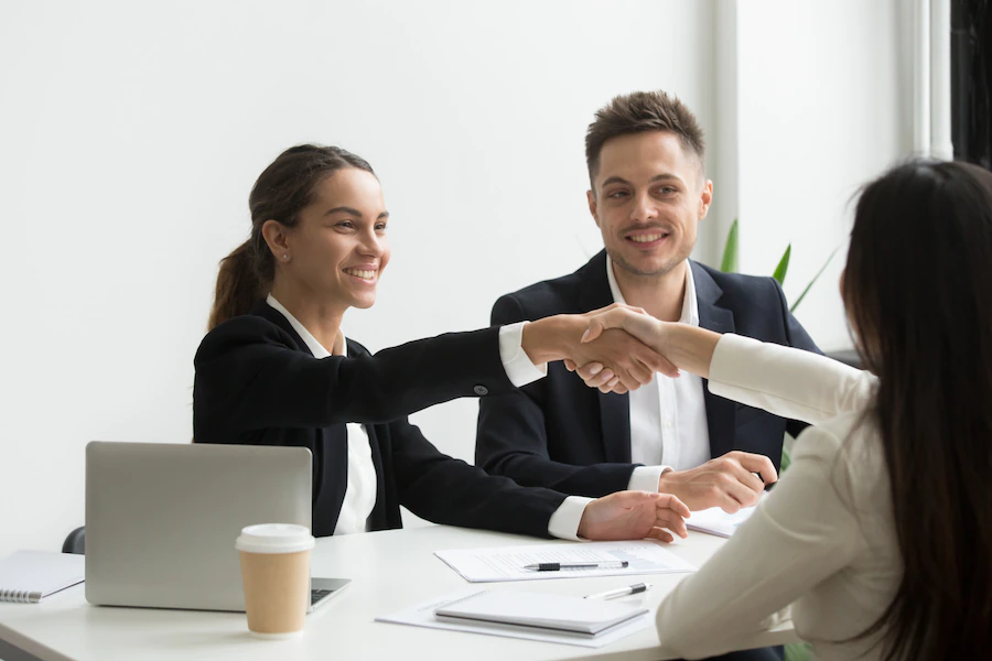 hr-representatives-positively-greeting-female-job-candidate_1163-4702-1